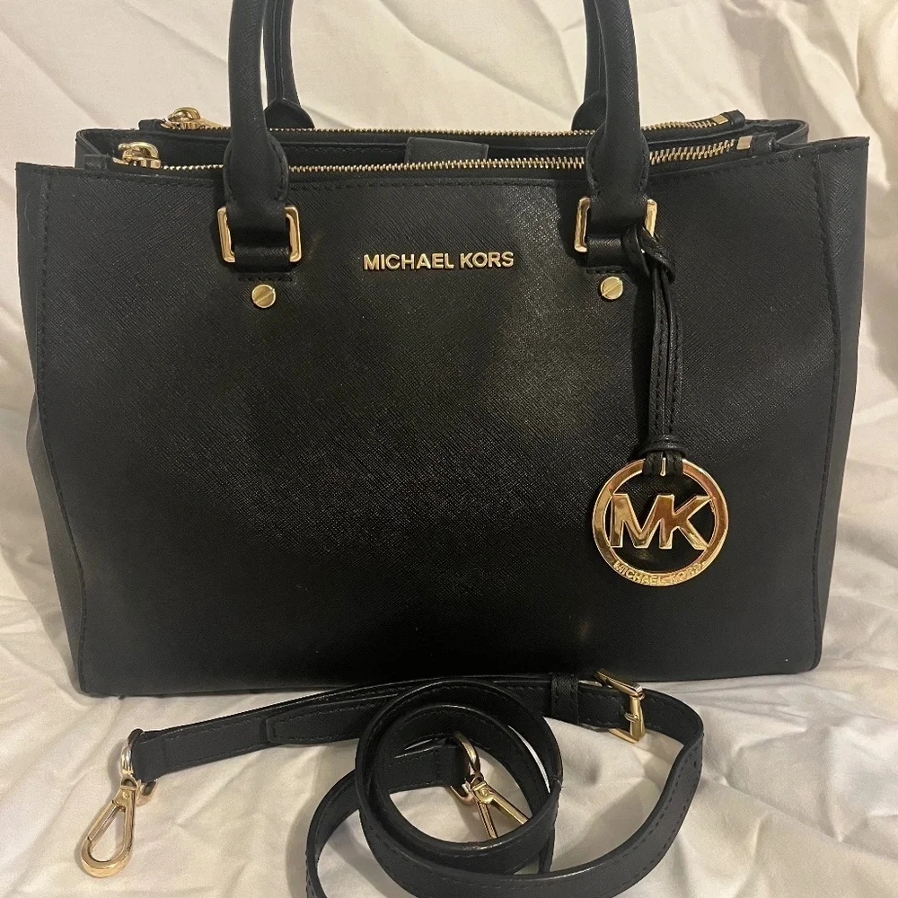 Michael Kors Medium Black Leather Bag. Barely used. Wear on shoulder / handles.